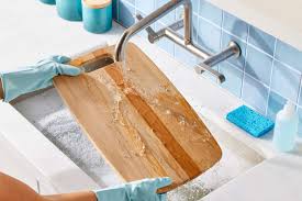 clean wooden cutting board with lemon and salt”