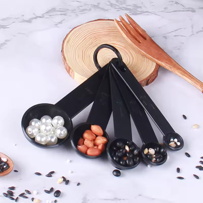 Durable stainless steel teaspoon measuring set with ring holder for organized kitchen storage and easy access during baking